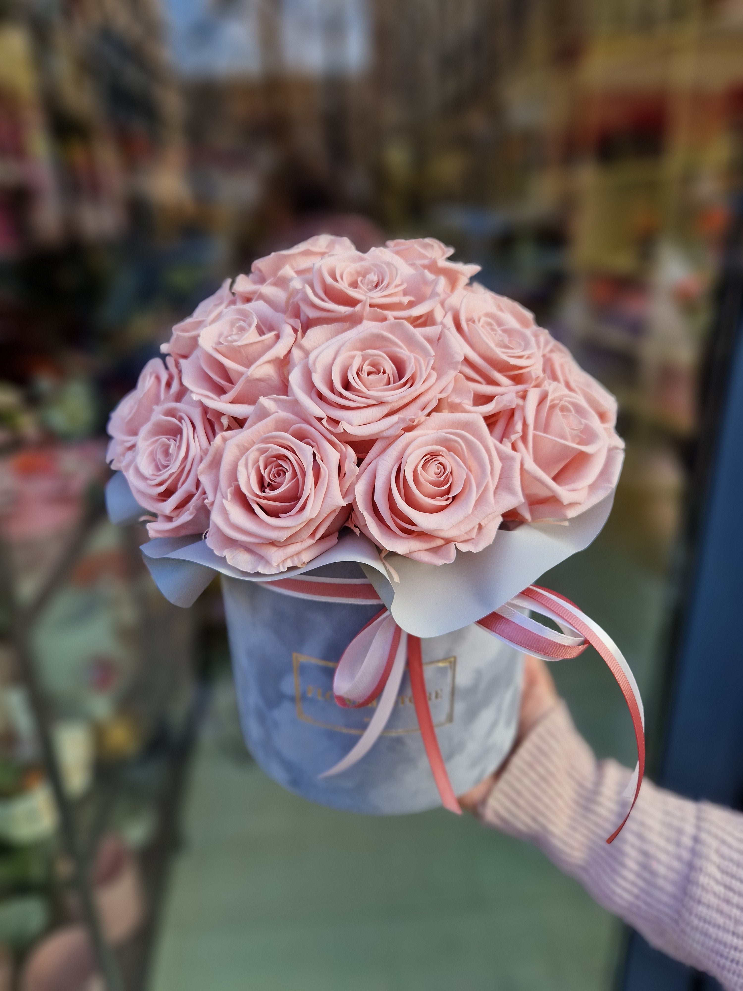 Eternal pink pink roses in a gray flocked box