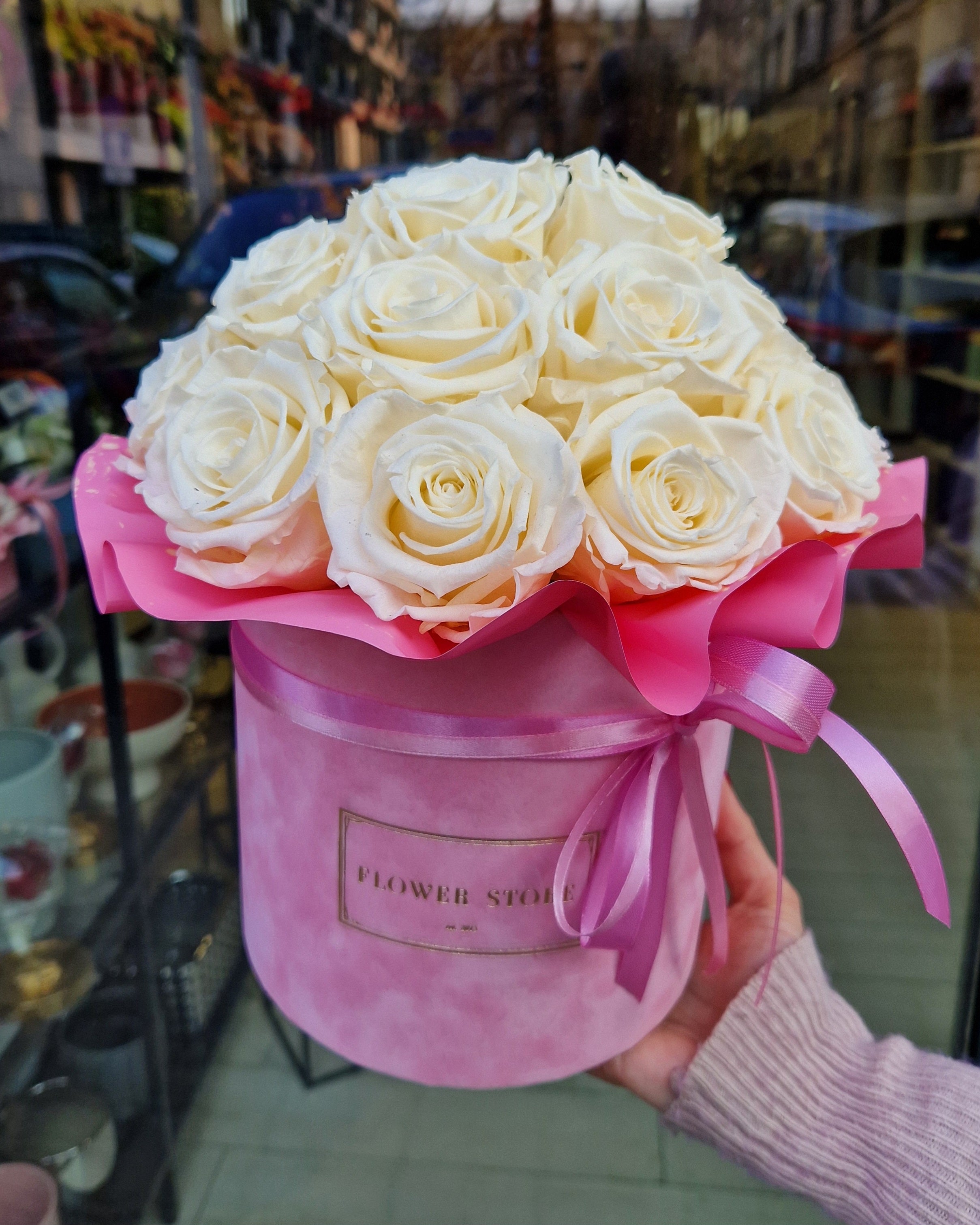 Eternal white roses in a pink flocked flowerbox